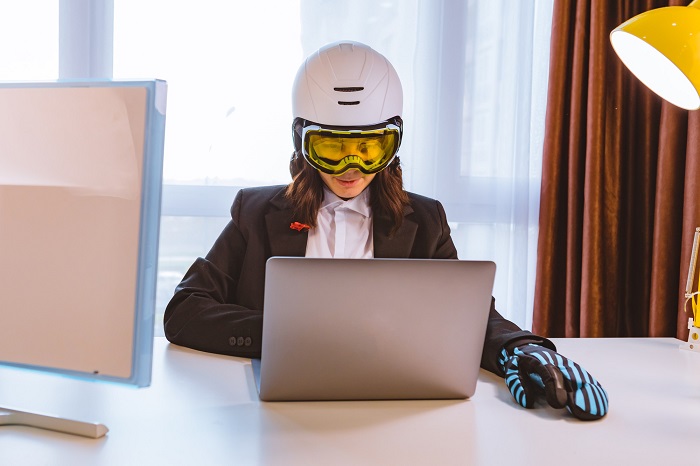 woman-wearing-glasses-and-helmet-working-with-laptop