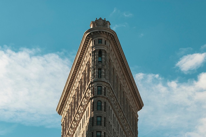 low-angle-shot-flatiron-building-madison-square-park-new-york-steel-frame-vintage-modern-architecture