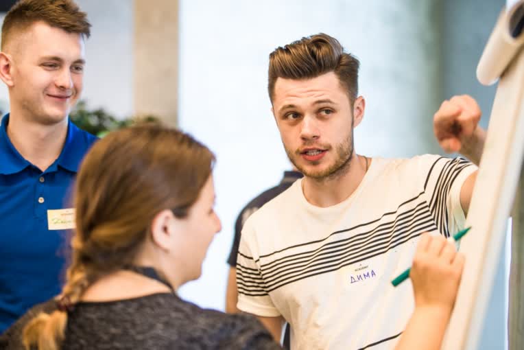 2_keep-your-emotional-health-in-shape-adidas-Russia-employee-pointing-at-flipchart-1440x9999.jpg